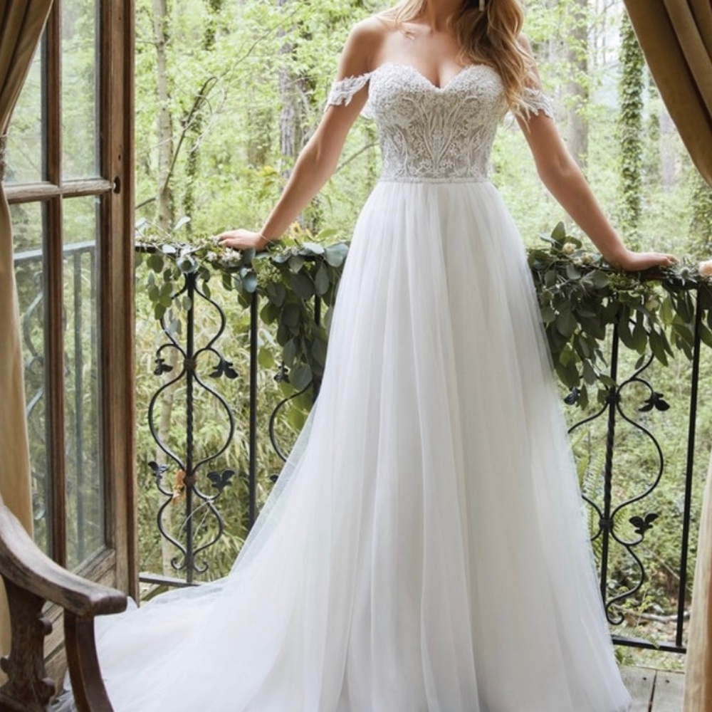 Brand new wedding dress. Bought for 1500 but then found my dream dress.